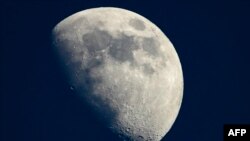 A photo taken on May 13, 2019 shows a view of the moon in Cannes, southern France. - The Moon is steadily shrinking, causing wrinkling on its surface and quakes, according to an analysis of imagery captured by NASA's Lunar Reconnaissance Orbiter (LRO) pub