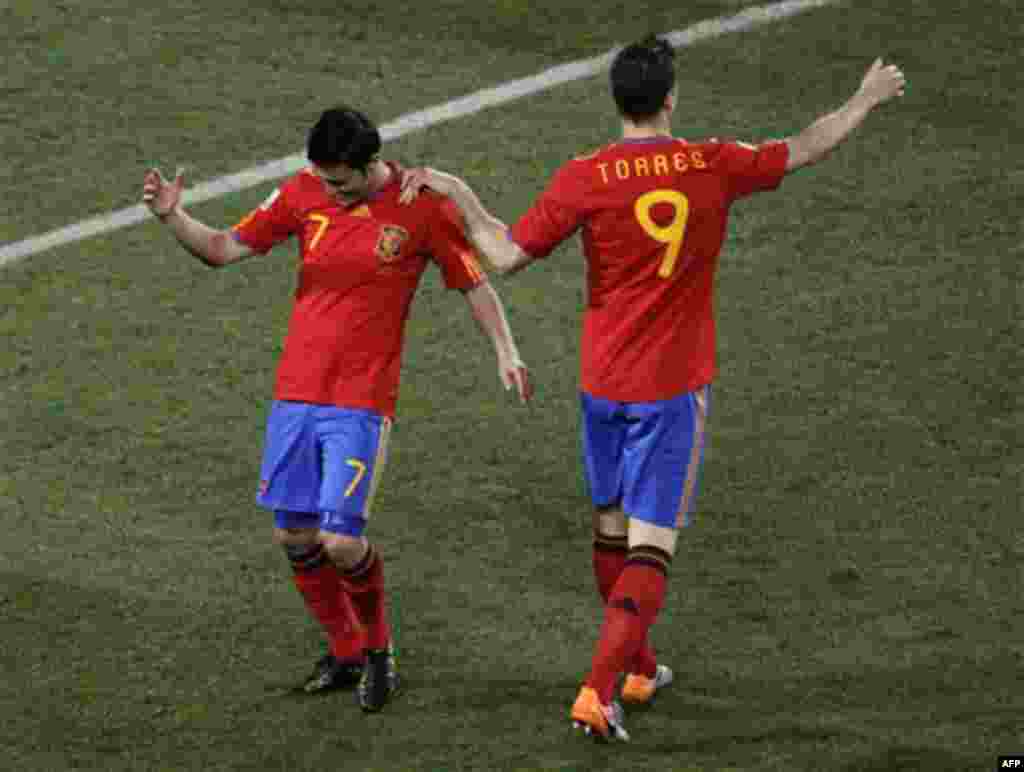 Spain's David Villa, left, celebrates after scoring his second goal with fellow team member Spain's Fernando Torres, right, during the World Cup group H soccer match between Spain and Honduras at Ellis Park Stadium in Johannesburg, South Africa, Monday, J