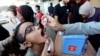 A Palestinian child is vaccinated against polio, amid the Israel-Hamas conflict, in Deir Al-Balah in the central Gaza Strip, Oct. 14, 2024.