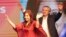 Peronist presidential candidate Alberto Fernández, behind, and running mate, former President Cristina Fernández, celebrate after the election results in Buenos Aires, Argentina, Oct. 27, 2019.