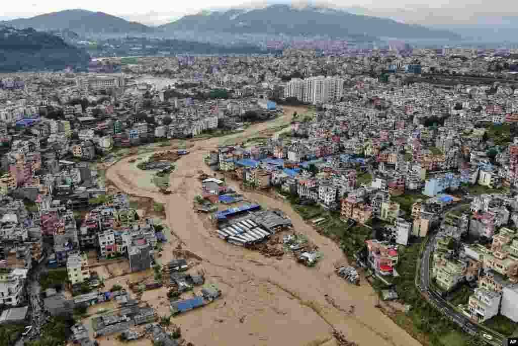 In this aerial image of the Kathmandu valley, Bagmati River is seen flooded due to heavy rains in Kathmandu, Nepal, Sept. 28, 2024. 