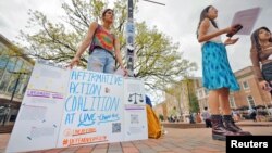 Affirmative Action Coalition student activists Avery Hobgood (L), Sarah Zhang (C) and Christina Huang (R) advocate for race-conscious admissions to colleges on the University of North Carolina campus in Chapel Hill, North Carolina, March 27, 2023.