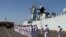 FILE - Cambodian navy officials attend a ceremony after conducting an exercise with Chinese naval officers in Preah Sihanouk province, Cambodia, Feb. 26, 2016.