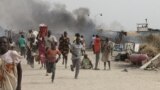 FILE - South Sudanese civilians flee fighting in an United Nations base in the northeastern town of Malakal on February 18, 2016, where gunmen opened fire on civilians sheltering inside killing 30 people and injuring 123 others.