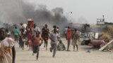 South Sudanese civilians flee fighting in an United Nations base in the northeastern town of Malakal on February 18, 2016.