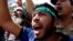 Supporters of Egyptian President Mohamed Mursi shout slogans during a protest around the Raba El-Adwyia mosque square in the suburb of Nasr City, Cairo, June 28, 2013.