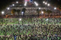 In this aerial view, participants gather for a vigil to remember the victims of the 1989 Tiananmen Square Massacre, despite permission for it being officially denied, at Victoria Park in Causeway Bay, Hong Kong, June 4, 2020.