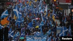 FILE - Demonstrators march for Scottish Independence through Glasgow City center in Scotland, Jan. 11, 2020.