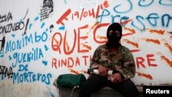 A demonstrator poses for a photo, as he takes part in the funeral service of Jose Esteban Sevilla Medina, who died during clashes with pro-government supporters in Monimbo, Nicaragua July 16, 2018.