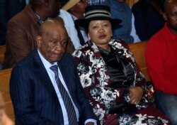 FILE - Lesotho's Prime Minister, Thomas Thabane, left, and his wife Maesaiah are seated in court, in Maseru, Feb. 24, 2020.