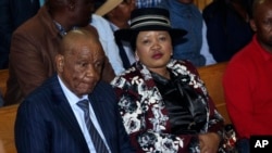 FILE - Lesotho's prime minister, Thomas Thabane, and his wife, Maesaiah, in court in Maseru on Feb. 24, 2020.