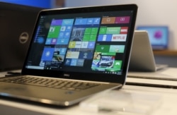 FILE - A laptop computer featuring Windows 10 is seen on display at Microsoft Build in San Francisco, April 29, 2015.