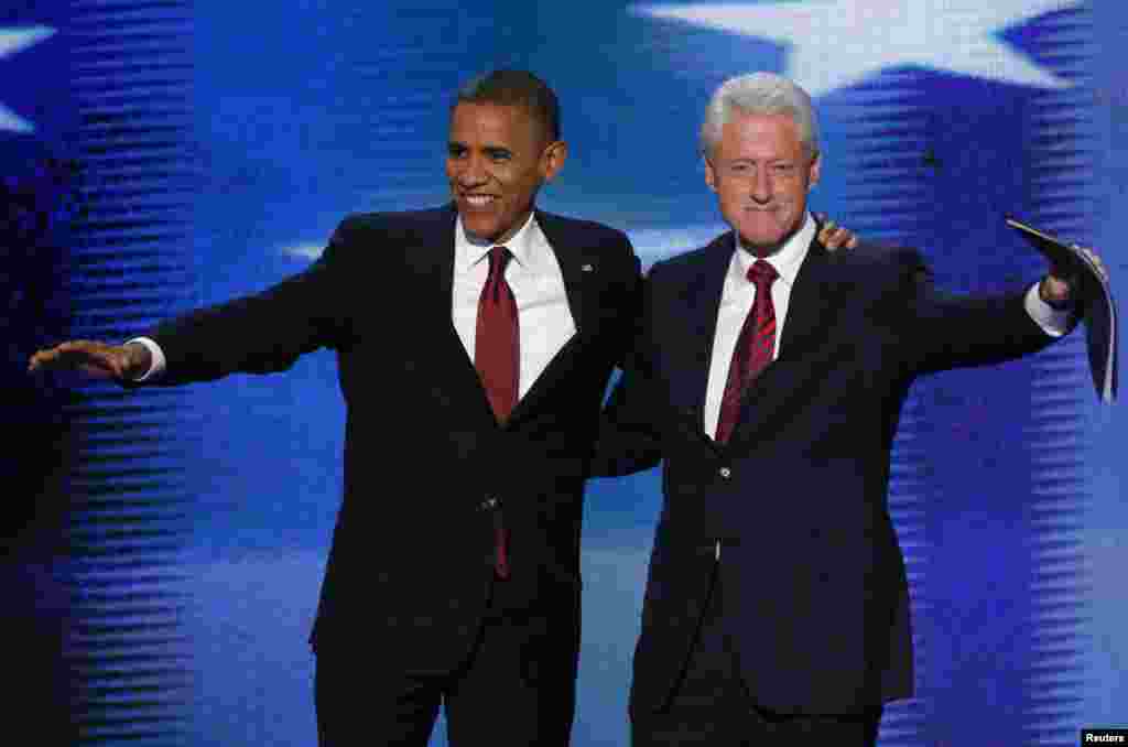 U.S. President Barack Obama (L) joins former President Bill Clinton onstage after Clinton nominated Obama for re-election during the second session of the Democratic National Convention in Charlotte, North Carolina, September 5, 2012. 