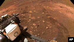 FILE - This photo made available by NASA was taken during the first drive of the Perseverance rover on Mars on March 4, 2021. Perseverance landed on Feb. 18, 2021. 