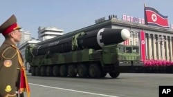 In this image made from video by North Korea's KRT, a military parade is held in Pyongyang, North Korea, Feb. 8, 2018. North Korea's intercontinental ballistic missiles highlighted the event.