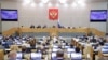 FILE - In this photo provided by the State Duma, deputies attend a session at the State Duma, the Lower House of the Russian Parliament in Moscow, Russia, May 19, 2021. 
