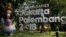 Seorang petugas kebersihan bekerja di dekat logo Asian Games 2018 di Jakarta, 17 September 2017. 