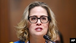 FILE - Sen. Kyrsten Sinema, D-Ariz., speaks during a committee hearing on Capitol Hill in Washington, Oct. 19, 2021. 