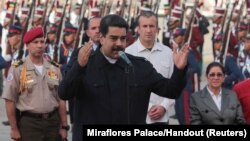 Venezuela's President Nicolas Maduro (C) speaks after his arrival at the Simon Bolivar airport in La Guaira, Venezuela, Oct. 7, 2017. 