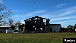 FILE PHOTO: The structure of a mosque is seen one day after a fire at the Victoria Islamic Center inn Victoria, Texas Jan. 29, 2017. 