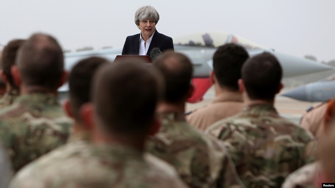 Britain's Prime Minister Theresa May speaks to the troops at RAF Akrotiri, one of two military bases Britain maintains on the east Mediterranean island of Cyprus, Dec. 22, 2017. 