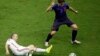 Spain's Andres Iniesta tries to reach the ball against Netherlands' Daryl Janmaat during the group B World Cup soccer match between Spain and the Netherlands at the Arena Ponte Nova in Salvador, Brazil, June 13, 2014. 