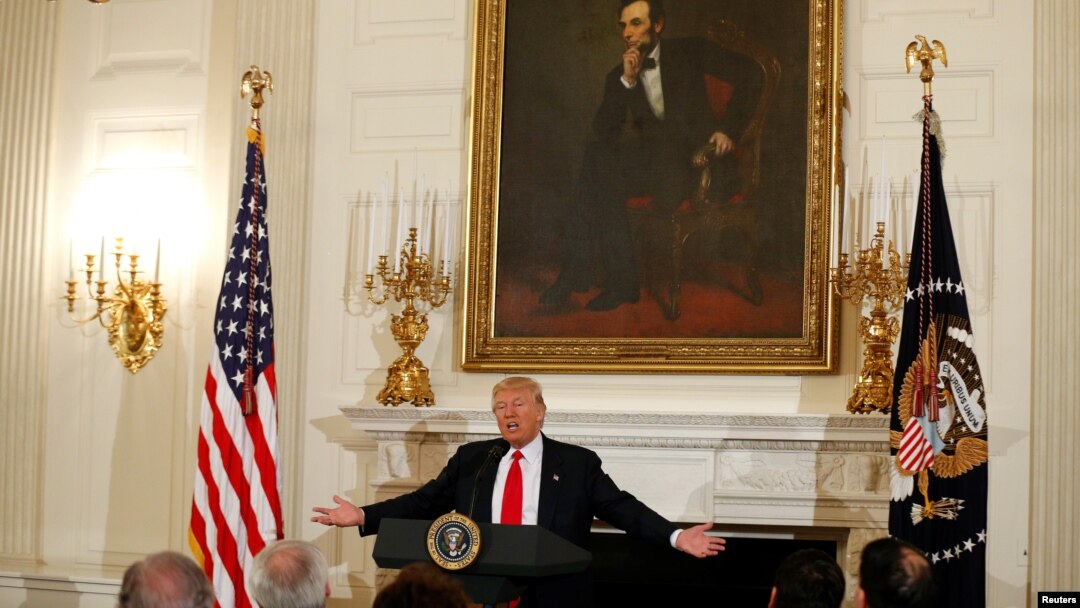 Under a painting of President Abraham Lincoln, U.S. President Donald Trump speaks during a National Governors Association meeting at the White House in Washington, Feb. 27, 2017.