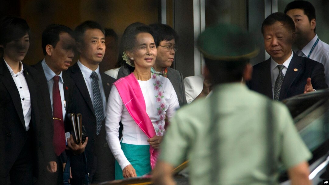 Myanmar's opposition leader Aung San Suu Kyi arrives at Beijing Capital International Airport in Beijing, China, June 10, 2015.