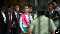 Myanmar's opposition leader Aung San Suu Kyi arrives at Beijing Capital International Airport in Beijing, China, June 10, 2015.