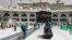 Workers clean the Grand Mosque, during the minor pilgrimage, known as Umrah, in the Muslim holy city of Mecca, Saudi Arabia, Monday, March 2, 2020. 