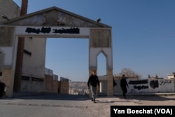 The archway that once read 'Assad Forever' is now blacked out in an area where former regime soldiers and their families still live, in Damascus, Syria, on Jan. 19, 2025.