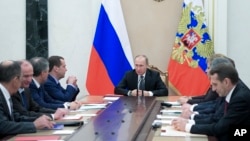 FILE - Russian President Vladimir Putin chairs a Security Council meeting in the Kremlin in Moscow, Russia, Jan. 13, 2017. Experts say Putin has made it his foreign policy goal to weaken America’s traditional links to its allies and to divide NATO.