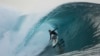FILE - A surfer rides a wave in Teahupo'o, Tahiti, French Polynesia, Saturday, Jan. 13, 2024. The world-famous surf spot is set to host the 2024 Paris Olympics surfing competition. 