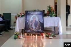 FILE - A portrait of journalist Martinez Zogo is placed in a room at Radio Amplitude FM to pay tribute to him, in the Elig Essono district of Yaounde on January 23, 2023.