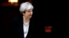 Britain's Prime Minister Theresa May walks to welcome Ukraine's President Petro Poroshenko prior to their talks, at 10 Downing Street in London, April 19, 2017.