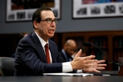 FILE - Treasury Secretary Steven Mnuchin testifies before a House Appropriations subcommittee on Capitol Hill in Washington, April 9, 2019.