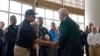 President Joe Biden shakes hands with Florida Chief Financial Officer and State Fire Marshal Jimmy Patronis during a meeting with first responders in Miami Beach, Fla., Thursday, July 1, 2021. (AP Photo/Susan Walsh)