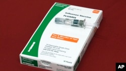 FILE - A flu vaccine is displayed at a pharmacy in New York, on Tuesday, Sept. 24, 2024. (AP Photo/Mary Conlon, File)