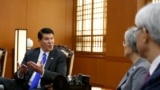 Keith Krach, left, U.S. under secretary of State for Economic Growth, Energy and the Environment, talks with South Korea's Foreign Minister Kang Kyung-wha, second from right, during their meeting at the Foreign Ministry in Seoul, South Korea,…