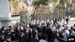 Iranian students scuffle with police at the University of Tehran during a demonstration driven by anger over economic problems, in the capital Tehran, Iran, Dec. 30, 2017. 