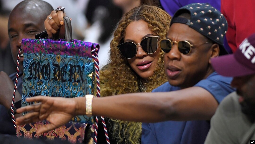 FILE - Beyonce and Jay Z watch during the first half of an NBA basketball first-round playoff series between the Los Angeles Clippers and the Utah Jazz in Los Angeles, -April 30, 2017. 