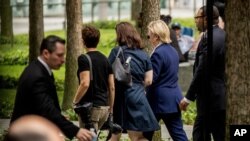 Democratic presidential candidate Hillary Clinton departs after attending a ceremony at the Sept. 11 memorial, in New York, Sunday, Sept. 11, 2016