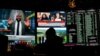 The first public impeachment hearing of President Donald Trump plays on a screen at the Superbook sports book inside the Westgate casino-hotel Wednesday, Nov. 13, 2019, in Las Vegas. (AP Photo/John…