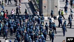 Bangladesh police try to disperse anti-Discrimination Student during a clash with police in Dhaka on August 4, 2024. (Photo by Munir UZ ZAMAN / AFP)