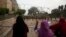 Women supporting deposed Egyptian President Mohamed Morsi shout at members of the Republican Guards blocking protesters near a Republican Guards headquarters in Cairo, July 9, 2013.