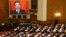 China's Premier Wen Jiabao (shown on screen) speaks as delegates listen during the opening ceremony of National People's Congress (NPC) at the Great Hall of the People in Beijing, March 5, 2013. 