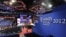 Workers prepare the stage for the Republican National Convention inside the Tampa Bay Times Forum in Tampa, Florida, Aug. 25, 2012. 