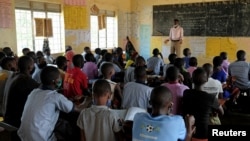 Students attend a class at the Sweswe Primary School after schools reopened following the COVID-19 shutdown in Kyaka II Refugee Settlement, in Kyegegwa District, Uganda, Jan. 11, 2022. 