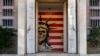 The entrance to the former US Embassy, which has been turned into an anti-American museum, is seen with a satirized image of the Statue of Liberty and the US flag in Tehran, Iran, Oct. 22, 2024. 