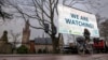 Activists protest outside the International Court of Justice, left, in The Hague, Netherlands, as it opens hearings into what countries worldwide are legally required to do to combat climate change, Dec. 2, 2024.